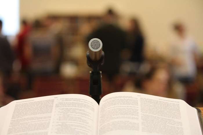 Open Bible and Microphone at a Lecture