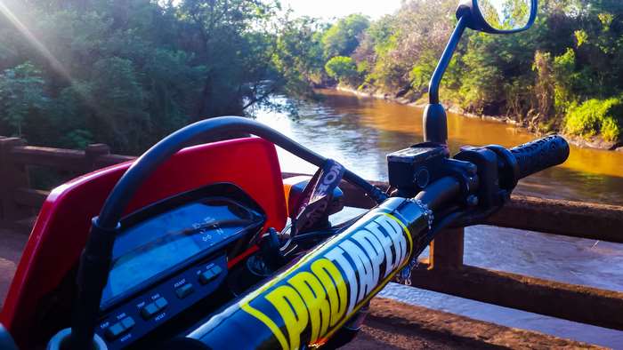 Honda Tornado motorcycle on a bridge over a river