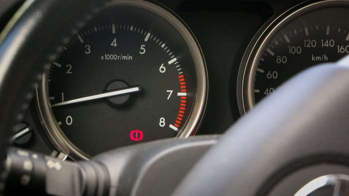 Mazda car dashboard with tachometer and speedometer
