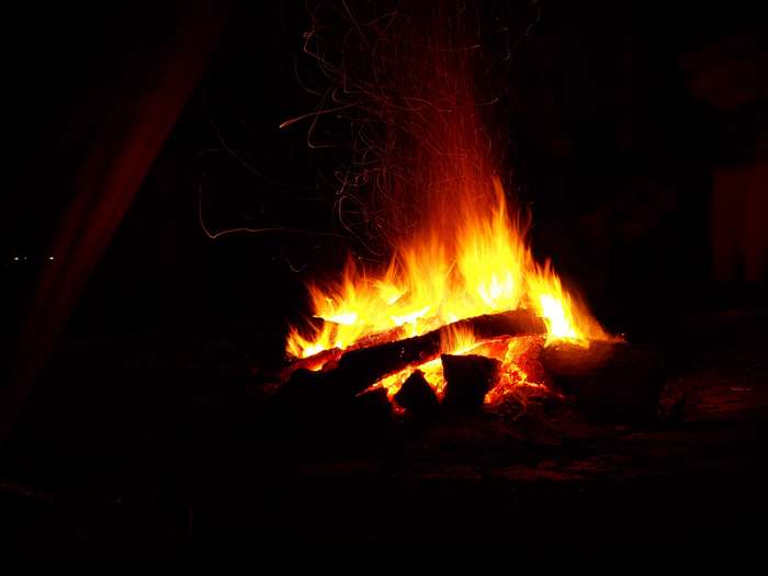 Campfire with sparks at night 4K