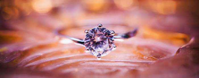 Diamond ring on a textured surface, macro shot