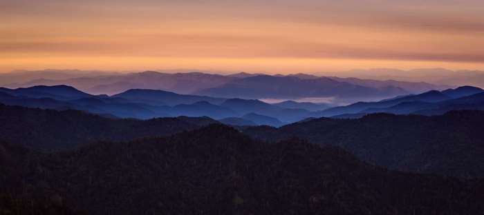 Mountain range at dawn with fog and sky 4K