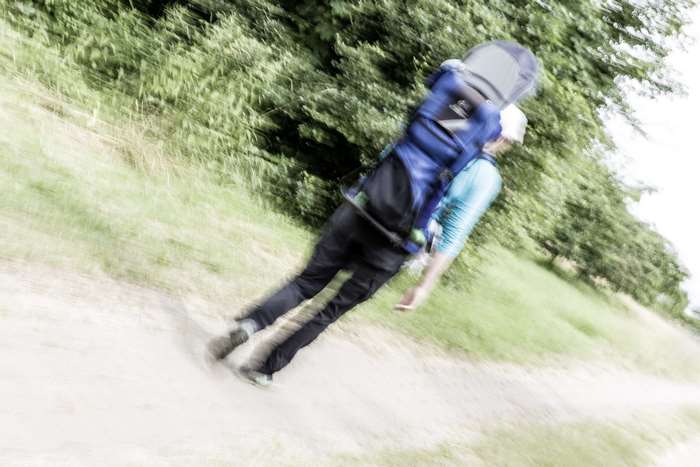 Hiker with backpack on a path
