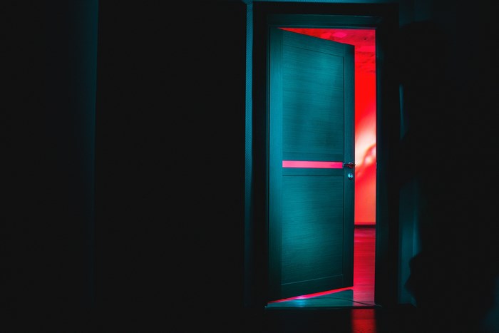 Open Door with Red Neon Light Glow