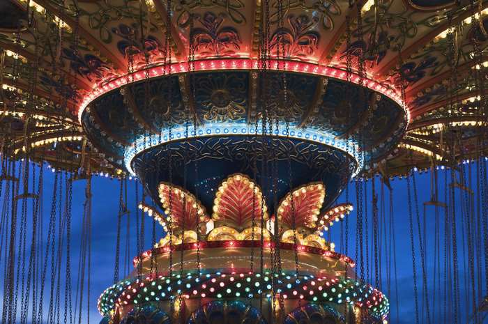 Illuminated carousel ride at dusk
