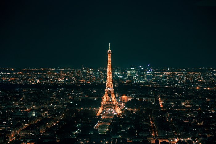 Illuminated Eiffel Tower and Paris Cityscape at Night