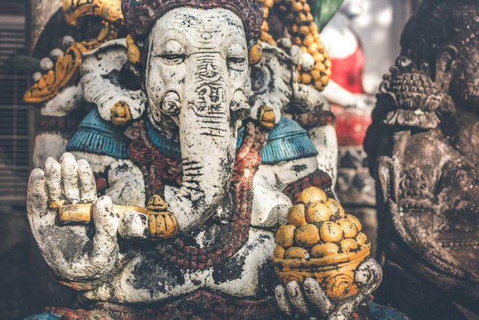Intricate Ganesha Statue Holding Sweet Offerings