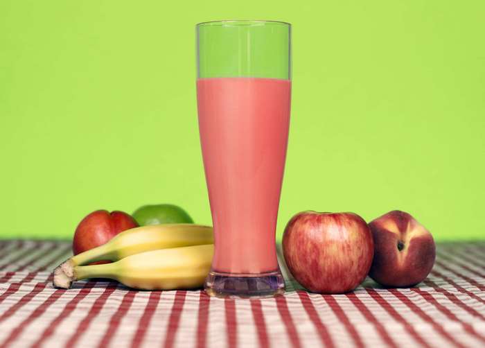 Fruit smoothie with apples, bananas, and peaches 4K