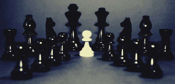 Black and white chess pieces arranged on a board