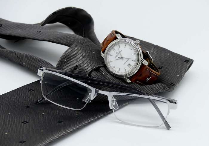 Men's accessories: tie, watch, and glasses