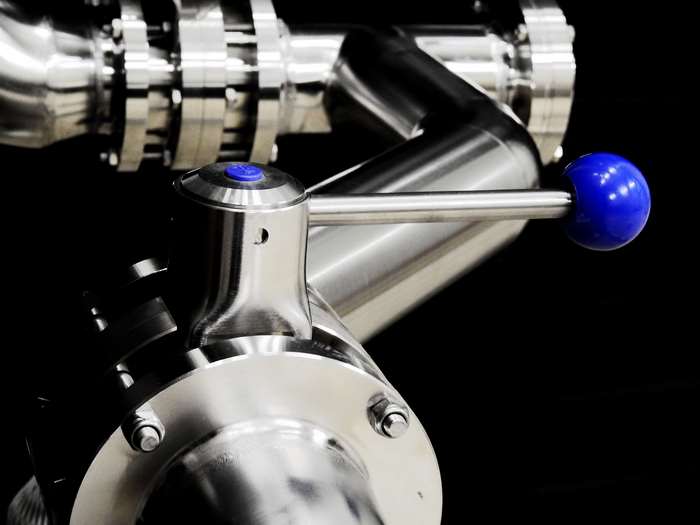 Stainless steel valve with blue handle and button