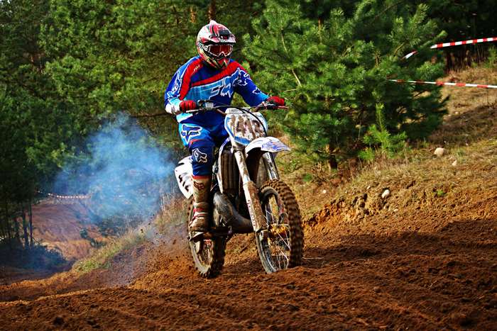 Motocross rider on a dirtbike on a track