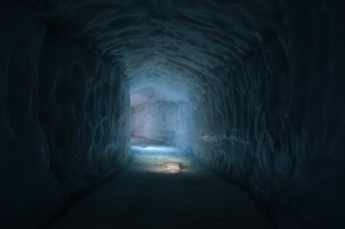 Dimly Lit Tunnel with Soft Blue Glow