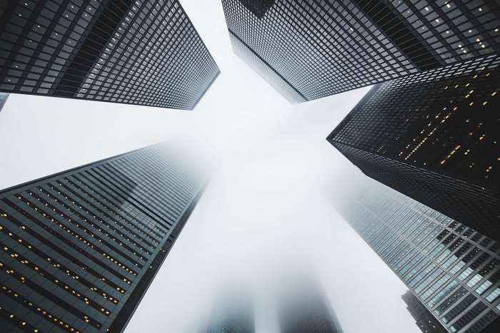 Skyscrapers in fog, low angle shot, 4K