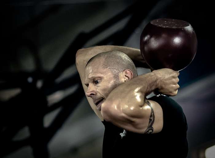 Man performing kettlebell training with a kettlebell