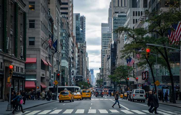 New York City street with yellow cabs and pedestrians