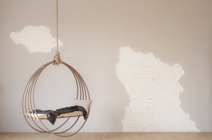 Hanging circular chair with pillow and blanket