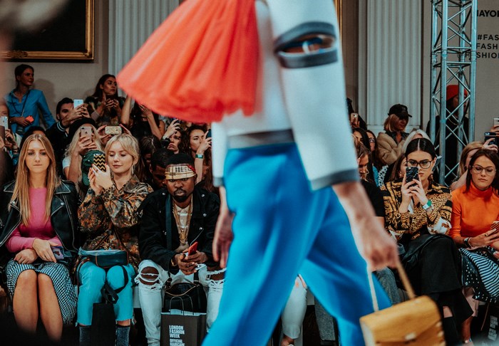 London Fashion Week audience watching a model walk
