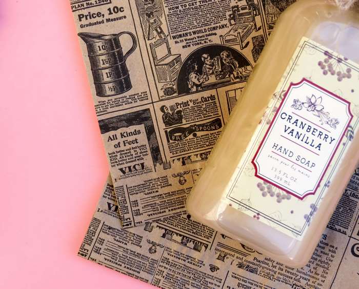 Cranberry Vanilla Hand Soap on Vintage Newspaper Background