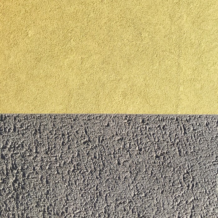 Yellow and grey textured wall