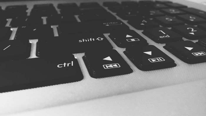 Close-up of a black laptop keyboard with visible keys