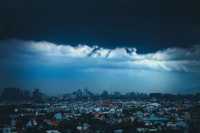 Cityscape under dark storm clouds
