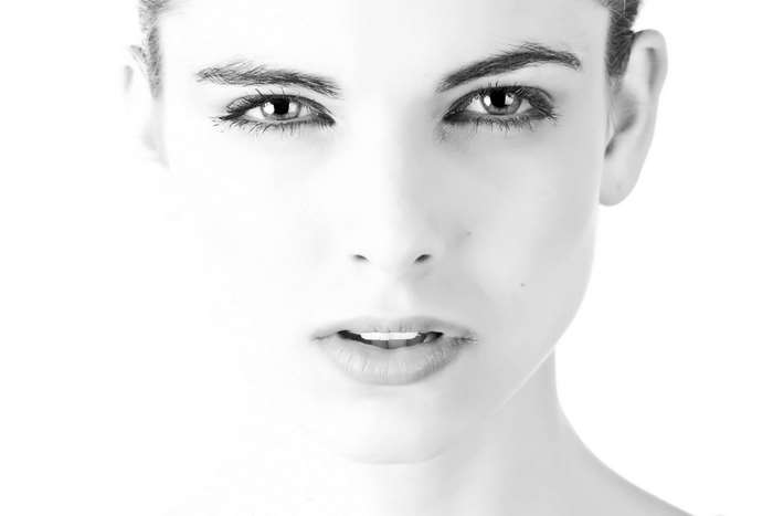 Black and white close-up of a young woman's face