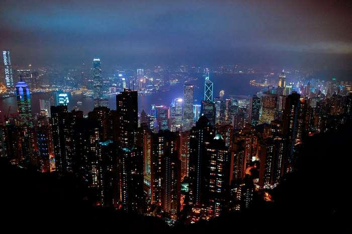 Hong Kong cityscape at night with illuminated skyscrapers