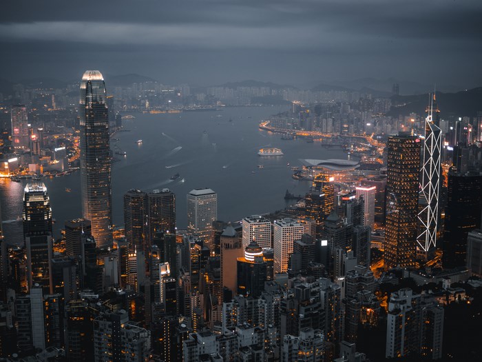 Hong Kong skyline at night with harbor