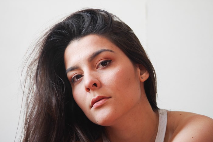 Woman with dark hair and makeup