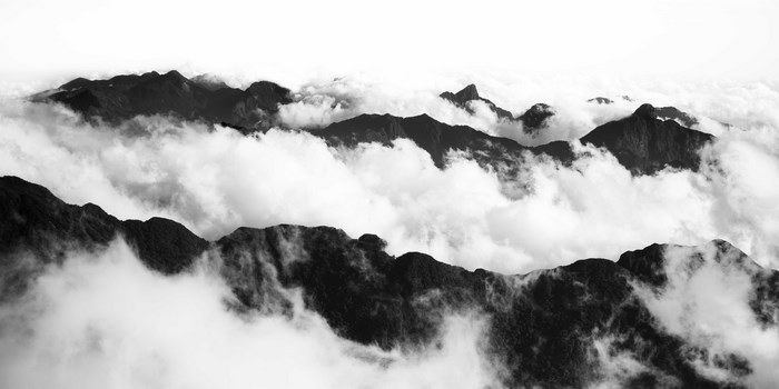 Black and white mountain range shrouded in clouds in Sapa, Vietnam