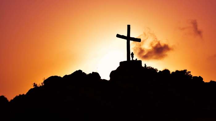 4K Sunset Silhouette of Cross on Hill with Figure