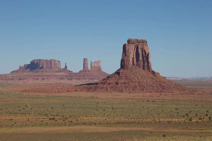 Monument Valley landscape with rock formations and desert