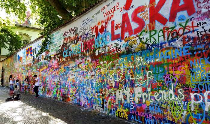 John Lennon Wall in Prague with Graffiti and People
