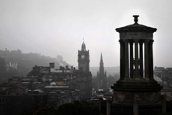 Edinburgh cityscape with monuments and clock tower