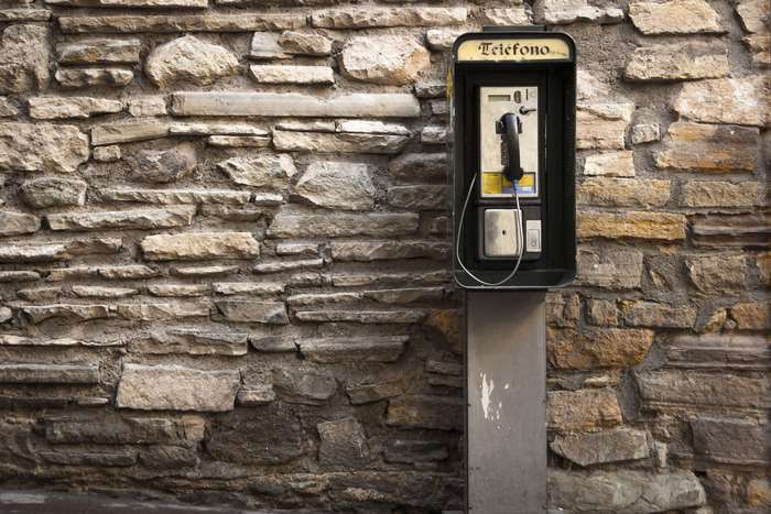 Payphone on a stone wall