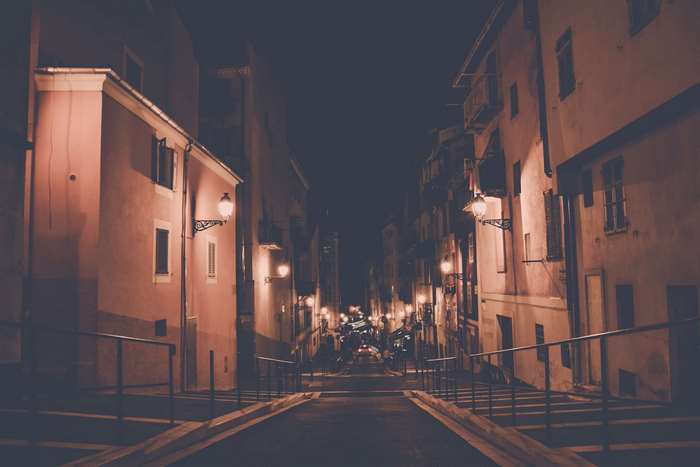Night street with buildings and streetlights