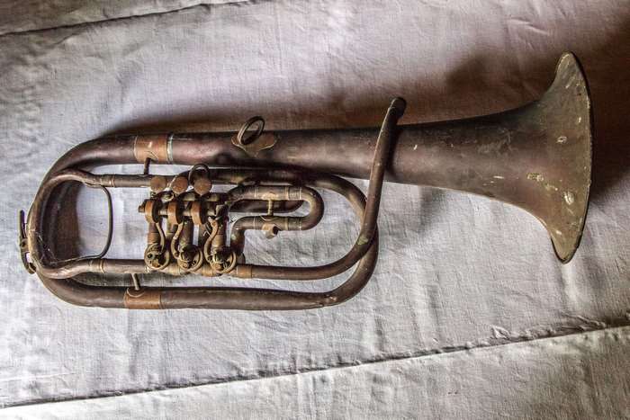 Antique brass horn instrument with valves
