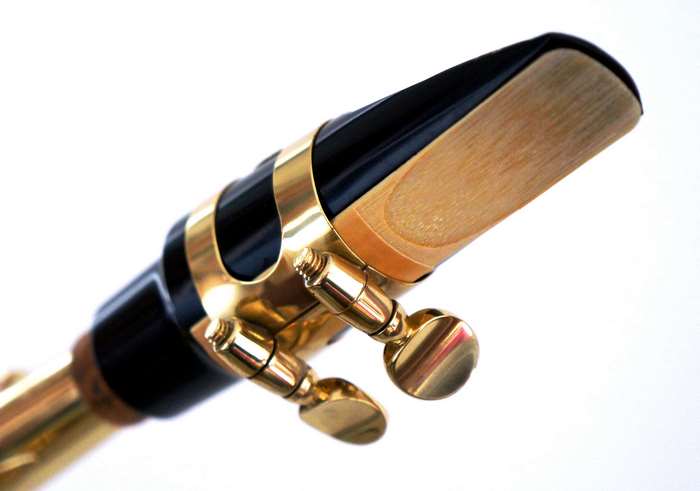 Close-up of a saxophone mouthpiece with a reed