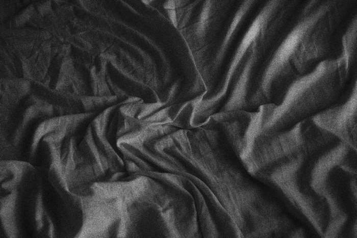 Textured dark fabric pattern 4K