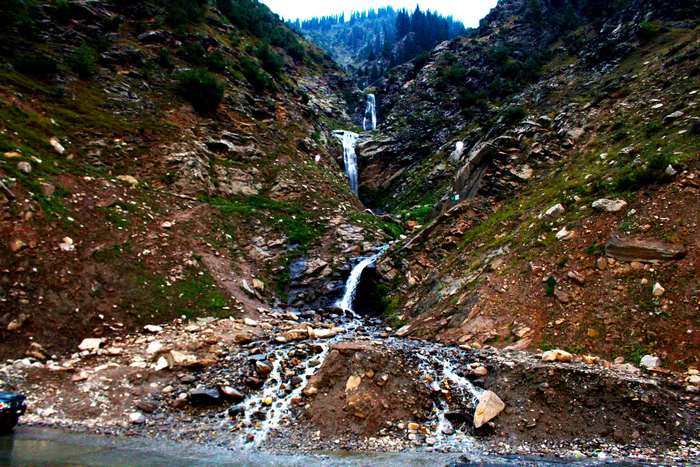 Waterfall cascading down a rocky mountain slope