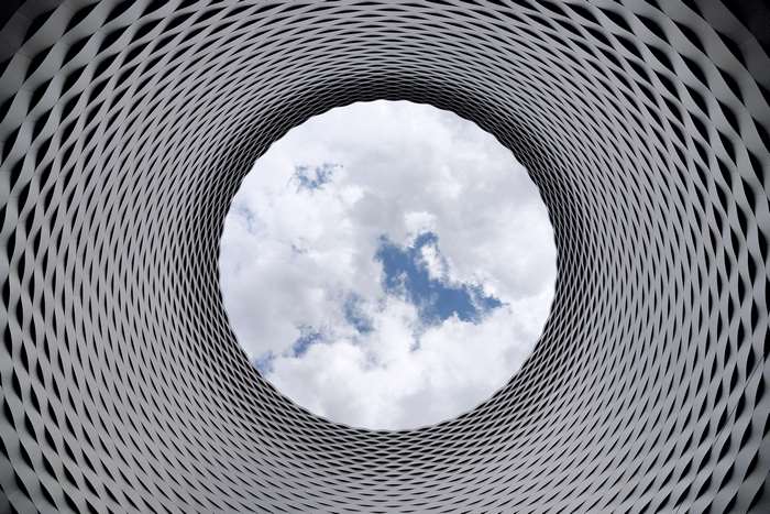 Abstract architectural pattern looking up at the sky