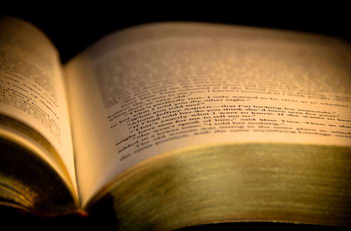 Close up of an open book with text