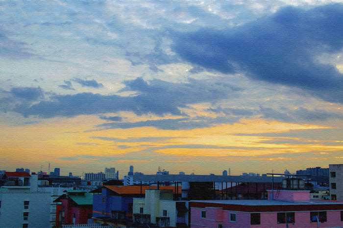 Cityscape at sunset with clouds