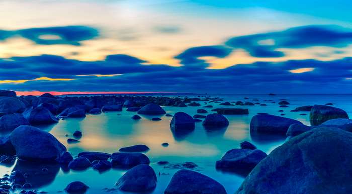 Rocky shore of the Baltic Sea at dawn 4K