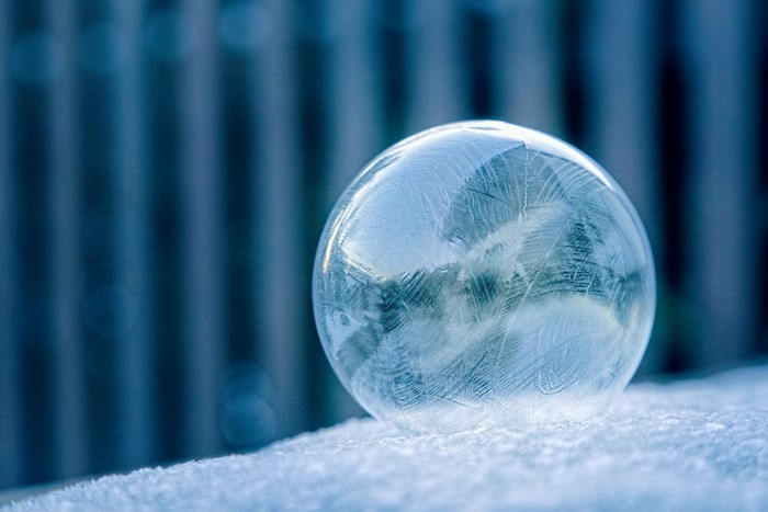 Frozen Soap Bubble on Snowy Surface