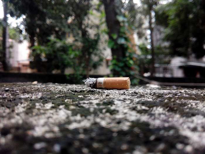 Cigarette butt on a textured surface