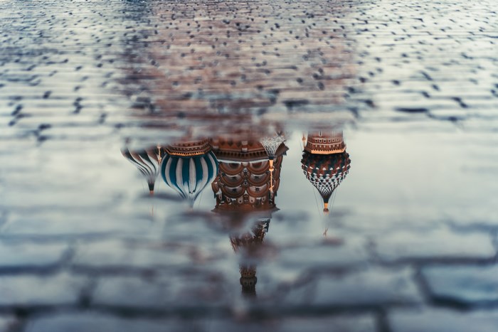 Reflection of St. Basil's Cathedral in a puddle on Red Square, Russia