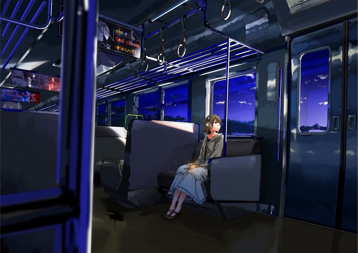 Girl listening to music on a train at night