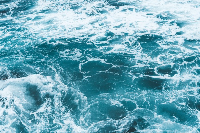 Ocean waves with white foam